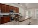 Modern kitchen features stainless appliances, granite counters, and a butcher block island at 34970 N Spur Cir, San Tan Valley, AZ 85144