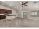 Bright kitchen with stainless appliances, granite counters, and an island with prep sink at 34970 N Spur Cir, San Tan Valley, AZ 85144