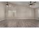 Bright living room boasting two ceiling fans and neutral wall paint at 34970 N Spur Cir, San Tan Valley, AZ 85144