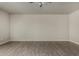 Living room featuring bright wall paint and wood-style tile flooring at 34970 N Spur Cir, San Tan Valley, AZ 85144