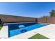 Sparkling backyard pool with clean, clear water, providing a refreshing oasis for hot summer days at 34970 N Spur Cir, San Tan Valley, AZ 85144