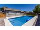 Inviting backyard pool with pristine blue water and a surrounding patio area, perfect for relaxing and entertaining at 34970 N Spur Cir, San Tan Valley, AZ 85144
