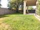 The backyard features a covered patio and ample green space, ideal for outdoor activities at 351 S Apache Dr, Chandler, AZ 85224