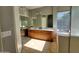 Bathroom featuring a double sink vanity, large mirror, tile floor and plenty of natural light at 351 S Apache Dr, Chandler, AZ 85224