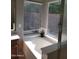 Bright bathroom with a tub, tile floor, and natural light at 351 S Apache Dr, Chandler, AZ 85224