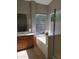 Bright bathroom with a tub, tile floor, vanity and natural light at 351 S Apache Dr, Chandler, AZ 85224