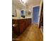 Bathroom features a wood cabinet vanity with dual sinks, tile floors, and a large mirror at 351 S Apache Dr, Chandler, AZ 85224