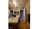 This bathroom features a wood cabinet vanity with dual sinks, tile floors, and a large mirror at 351 S Apache Dr, Chandler, AZ 85224