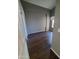 Bedroom featuring a large window, dark wood floors, and a walk in closet at 351 S Apache Dr, Chandler, AZ 85224