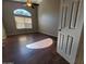 Spacious bedroom featuring ample natural light, ceiling fan, and dark wood floors at 351 S Apache Dr, Chandler, AZ 85224