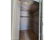 Walk-in closet featuring tile flooring, shelving, and a closet rod for storage at 351 S Apache Dr, Chandler, AZ 85224