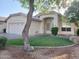 Charming home with landscaped front yard and a welcoming arched entryway at 351 S Apache Dr, Chandler, AZ 85224