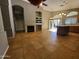 Spacious living room with fireplace, tile floors, backyard access, and modern lighting at 351 S Apache Dr, Chandler, AZ 85224