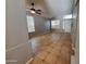 Bright living room with tiled floors, ceiling fan, and abundant natural light at 351 S Apache Dr, Chandler, AZ 85224