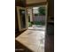 This home features a tile floored patio with double doors leading to the backyard at 351 S Apache Dr, Chandler, AZ 85224