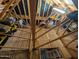 Spacious attic featuring ample storage space and visible rafters for potential customization at 3823 E Kroll Dr, Gilbert, AZ 85234