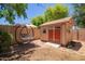 Backyard featuring a charming shed and swing chair, ideal for relaxation and outdoor activities at 3823 E Kroll Dr, Gilbert, AZ 85234