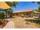 This backyard provides a serene retreat with a hammock and covered seating area, perfect for relaxation at 3823 E Kroll Dr, Gilbert, AZ 85234