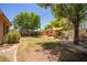 The spacious backyard features a shed, a hammock, and is perfect for outdoor enjoyment and relaxation at 3823 E Kroll Dr, Gilbert, AZ 85234