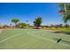 A well-maintained community basketball court surrounded by lush landscaping and trees, promoting an active lifestyle at 3823 E Kroll Dr, Gilbert, AZ 85234