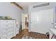 This bedroom features hardwood floors, a closet, and a dresser at 3823 E Kroll Dr, Gilbert, AZ 85234