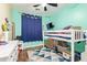 Bright, colorful bedroom with bunk beds, TV, and a cozy rug at 3823 E Kroll Dr, Gilbert, AZ 85234
