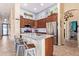 Modern kitchen featuring granite countertops, stainless steel appliances, and a center island with seating at 3823 E Kroll Dr, Gilbert, AZ 85234