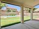 Inviting covered patio overlooking a spacious backyard with a refreshing pool and lush greenery at 4002 E Agave Rd, Phoenix, AZ 85044
