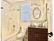 Bathroom featuring a glass bowl sink, modern fixtures, and a shower-tub combination at 4002 E Agave Rd, Phoenix, AZ 85044