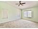 Spacious bedroom with large windows offering ample natural light, plus a ceiling fan at 4002 E Agave Rd, Phoenix, AZ 85044