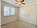 Bedroom with carpeted floors, neutral walls with moon, stars, and Dream-themed decorations, and a ceiling fan at 4002 E Agave Rd, Phoenix, AZ 85044