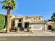 Charming two-story home with a tile roof, desert landscaping, and a welcoming two-car garage at 4002 E Agave Rd, Phoenix, AZ 85044