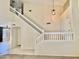 Foyer features staircase leading to the second floor with white banisters and modern lighting at 4002 E Agave Rd, Phoenix, AZ 85044