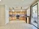 Beautiful kitchen with sleek appliances, tile backsplash, and sliding door access to backyard at 4002 E Agave Rd, Phoenix, AZ 85044