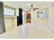 Bright living room featuring neutral walls, fireplace, ceiling fan, and tiled floors at 4002 E Agave Rd, Phoenix, AZ 85044