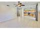 Open-concept space showcasing tile floors, a ceiling fan, and a seamless flow into the kitchen at 4002 E Agave Rd, Phoenix, AZ 85044