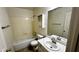 Standard bathroom featuring a tub-shower, toilet and vanity with sink, perfect for simple living at 43890 W Bedford Dr, Maricopa, AZ 85138