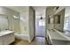Bathroom featuring a shower-tub combo, a tile floor, and a double vanity at 43890 W Bedford Dr, Maricopa, AZ 85138