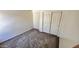 Neutral bedroom with fresh paint, new carpet and closet provides a serene and blank canvas to create your dreams at 43890 W Bedford Dr, Maricopa, AZ 85138