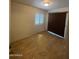 Small bedroom with light walls, tile floor, and a window with a shutter at 440 S Parkcrest -- # 22, Mesa, AZ 85206