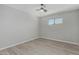 Cozy bedroom with wood-look floors, ceiling fan and window at 4441 N 27Th Dr, Phoenix, AZ 85017