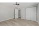 Bedroom features include ceiling fan, wood-look flooring and closet with slider doors at 4441 N 27Th Dr, Phoenix, AZ 85017