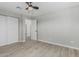 Bedroom features include ceiling fan, wood-look flooring and closet with slider doors at 4441 N 27Th Dr, Phoenix, AZ 85017