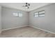 Bedroom with wood-look floors, neutral walls, ceiling fan, and windows providing natural light at 4441 N 27Th Dr, Phoenix, AZ 85017