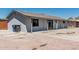 Side view of a single story home with blue recycling and trash bins at 4441 N 27Th Dr, Phoenix, AZ 85017
