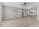Spacious living room with wood-look floors leading to the kitchen at 4441 N 27Th Dr, Phoenix, AZ 85017