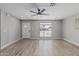 Bright living room featuring wood-look floors and neutral paint, large window at 4441 N 27Th Dr, Phoenix, AZ 85017