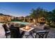 Backyard features a fire pit, spa, pool, gazebo, and outdoor seating perfect for entertaining friends at 4610 E Meadowview Dr, Gilbert, AZ 85298