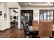 Dining room features a wine cellar wall, hardwood floors, and chandelier at 4610 E Meadowview Dr, Gilbert, AZ 85298