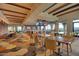 Expansive dining area featuring multiple seating options, TVs, and stylish decor at 4610 E Meadowview Dr, Gilbert, AZ 85298